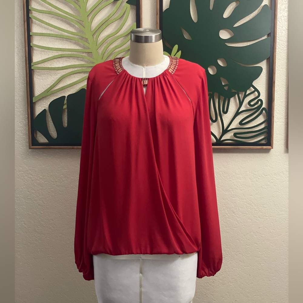 BcbgMaxazria Kaelyn Red Cut Out
Blouse with shiny jewels around neckband NWOT